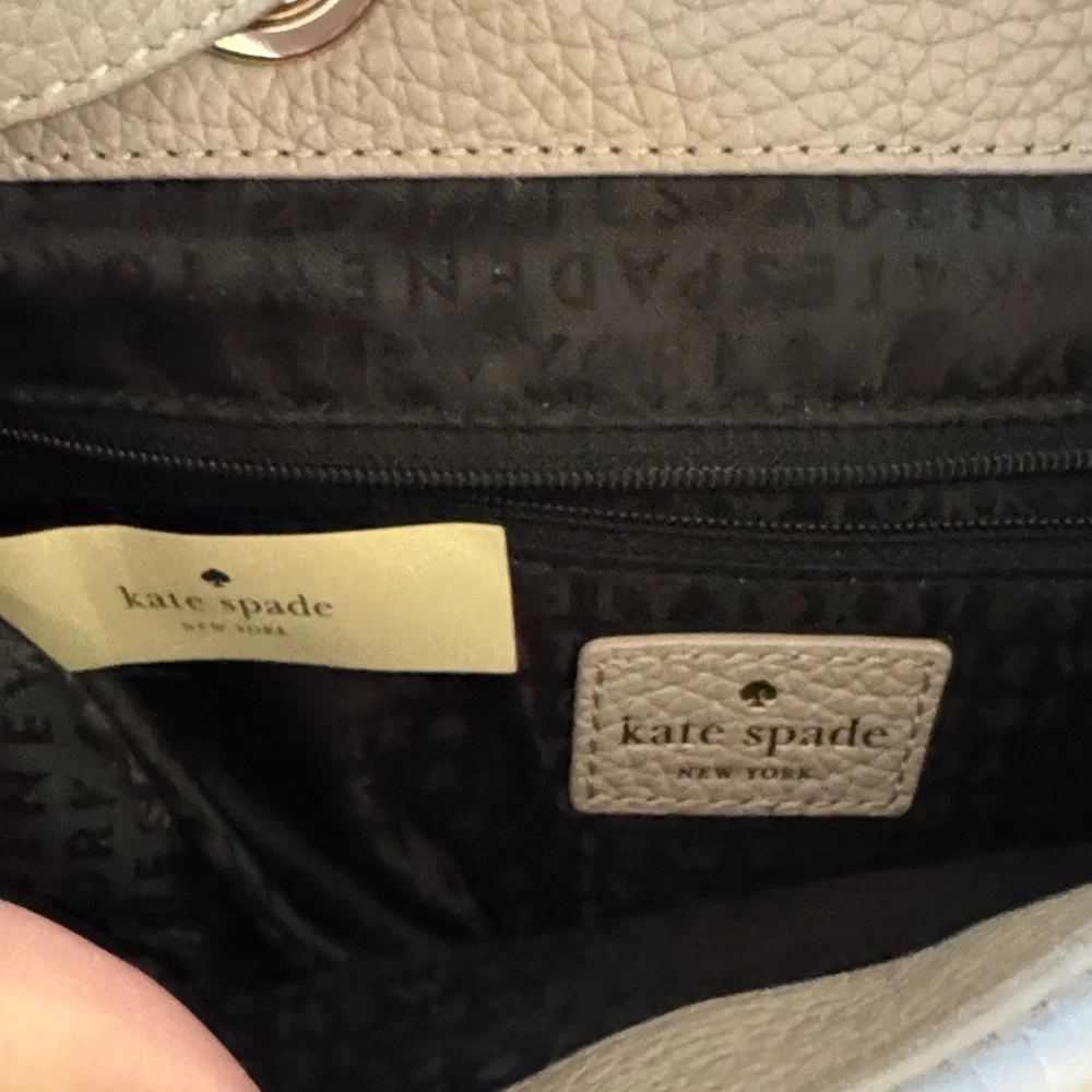 Kate Spade Chester Street Kacy Moussefrost with black accent and tassel backpack